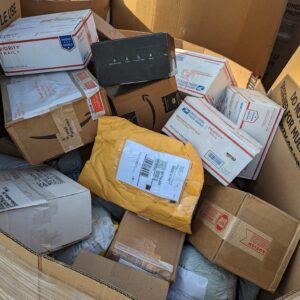 8Ft Tall USPS Unclaimed Mail Pallet: Mixed Undeliverable Parcels
